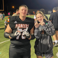 Needham siblings celebrate after a Pioneer victory
